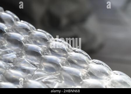 abstract close-up of packing bubble wrap diagonal against a dark background Stock Photo