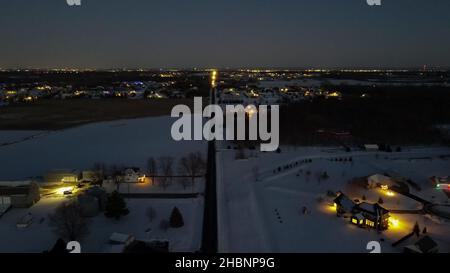 Aerial view as lights come on in rural areas Stock Photo