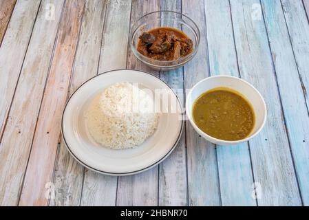 Arroz con gandules is a combination of rice, pigeon peas and pork cooked in the same pot with a Puerto Rican style sofrito. It is the star dish of Pue Stock Photo