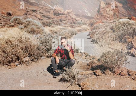 Young man in mountains or canyon Stock Photo