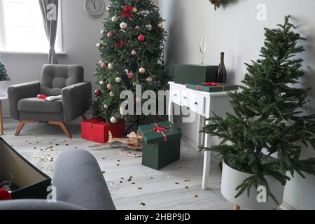 Interior of messy room after Christmas celebration Stock Photo