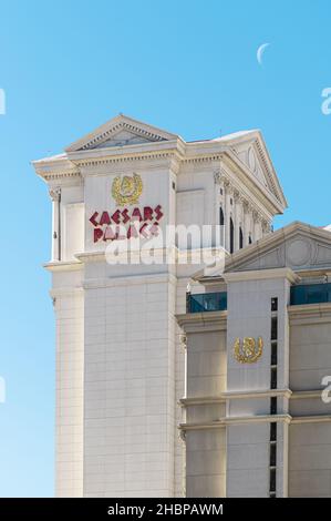 Las Vegas, Nevada, USA - November 29, 2021: Caesars Palace Hotel and Casino with a Blue Sky and the Moon in the Background Stock Photo
