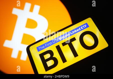 Ukraine. 20th Dec, 2021. In this photo illustration, a ProShares Bitcoin Strategy ETF (BITO) logo of the first U.S. bitcoin-linked ETF is seen on a smartphone screen and Bitcoin cryptocurrency sign in the background. Credit: SOPA Images Limited/Alamy Live News Stock Photo