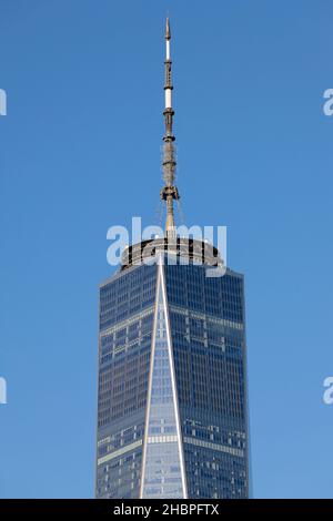 One World Trade Center and its rooftop spire against a sunny sky, New York, NY. Stock Photo