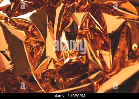 Blurred golden foil luxury texture. Defocused surface. Stock Photo