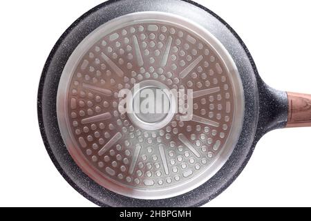 embossed bottom of the bottom of a metal frying pan with a brown handle on a white background Stock Photo