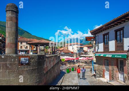 Potes village hanging old buildings over the Rio Quiviesa, Potes, Picos de Europa Cantabria, Spain Stock Photo