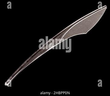 Plastic knife on black background Stock Photo