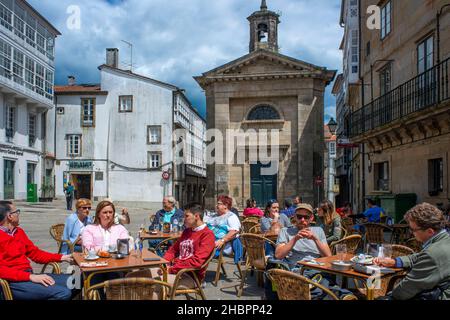 Bars restaurants at Plaza Cervantes Square in the historical town center is popular among pilgrims, tourists and locals alike Santiago de Compostela, Stock Photo