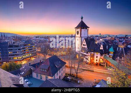 Freiburg im Breisgau, Germany. Aerial cityscape image of Freiburg im Breisgau, Germany with Swabian Gate at autumn sunset. Stock Photo