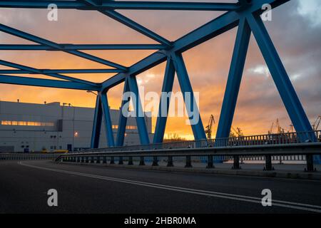 Asphalt road leading through an industrial area,image perfect as a background for 3d rendering Stock Photo
