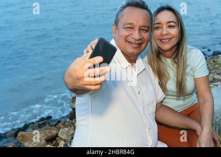 Older Couple Taking A Selfie With Their Mobile Stock Photo