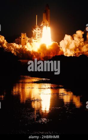 Launch of the spaceship from the spaceport at night. Flight of space shuttle in clouds of smoke. Some elements of this image are furnished by NASA