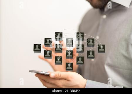 An abstract shot of male hands displaying contact icons connecting, networking in digital cyberspace Stock Photo