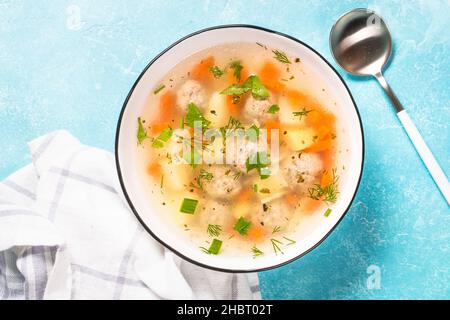 Meatballs soup with vegetables top view. Stock Photo