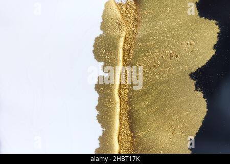 Abstract white and black texture with gold glitter. Stock Photo