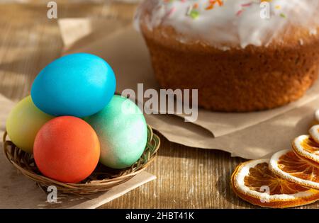 Eggs after coloring and kulich on wooden background Stock Photo