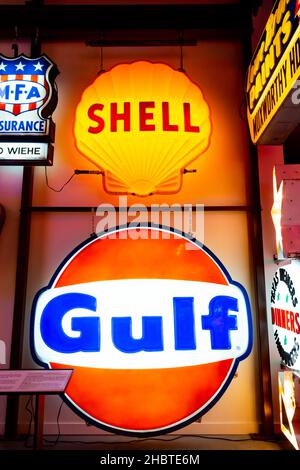 multicoloured illuminated glass logo  signs for Shell Oil and Gulf Stock Photo
