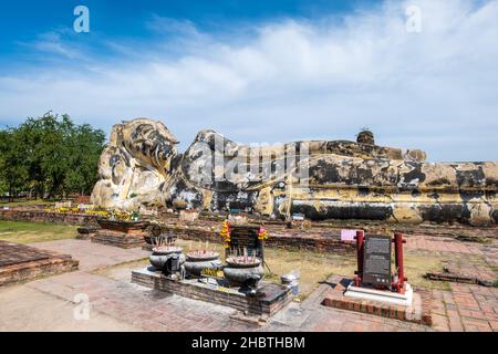 Reclining Buddha statue in Wat Lokaya Sutharam temple in Ayutthaya, a popular travel destination for tourists in Thailand. Stock Photo