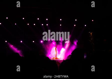 Microphone on the stage and spotlights with fog effect Stock Photo