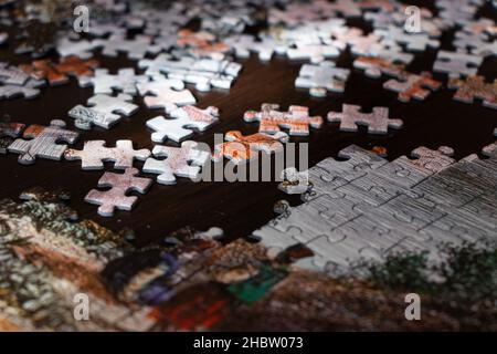 Pieces of a puzzle. Close-up view jigsaw puzzle. Selective focus Stock Photo
