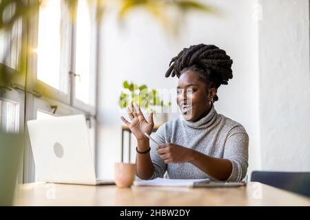 Woman working on laptop in her office Stock Photo