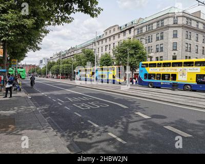 DUBLIN, IRELAND - Jul 04, 2019: An empty street in Dublin with row of buses Stock Photo