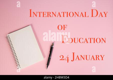 the representation of the international day of education with a notebook on a table Stock Photo