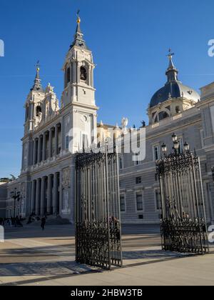 Almude Cathedral facacde seen behind the gates of the Mirador de la Cornisa, Madrid Stock Photo