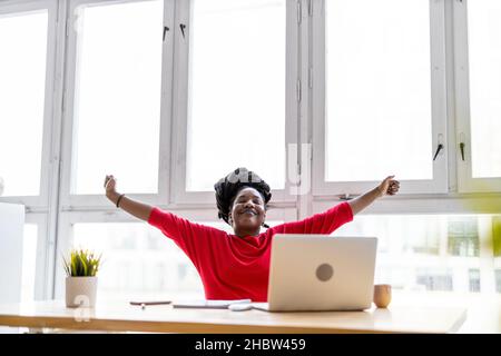 Woman working on laptop in her office Stock Photo