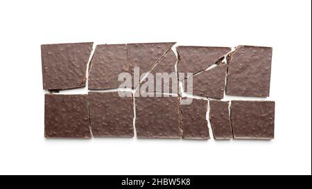 Broken chocolate bar. Dark chocolate isolated on white background. Stock Photo