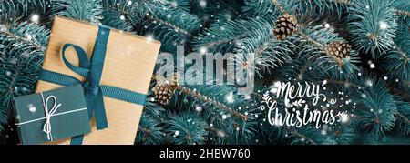 New Year banner. Presents on blue christmas tree background Stock Photo