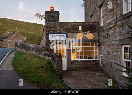 A village butchers shop with Christmas decoration, Bainbridge, Yorkshire Dales National Park, UK.