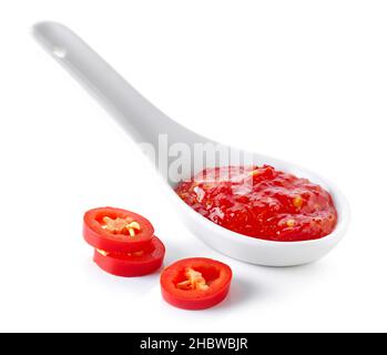 spoon of hot chili sauce isolated on white background Stock Photo