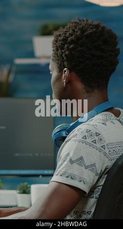 Person programming website firewall with codes on computer. Programmer coding web interface with binary code and network system for cybersecurity and protection. Coder designing server Stock Photo