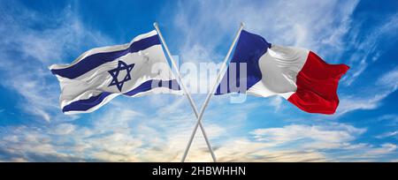 two crossed flags of France waving in the wind at cloudy sky ...