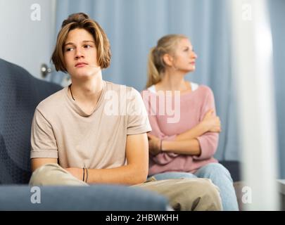 Portrait of unhappy son after discord with mother Stock Photo