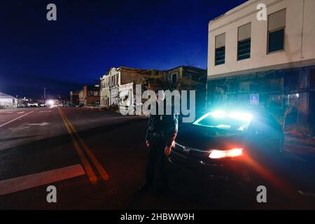 MAYFIELD, KENTUCKY - DECEMBER 20: Private security from Overwatch Security Group guards downtown after the National Guard pulled out, on December 20, 2021 in Mayfield, Kentucky.  Multiple nighttime tornadoes struck several Midwest states on December 10, causing widespread destruction and multiple casualties. Stock Photo