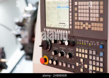 CNC control panel of turret lathe machine. Selective focus. Stock Photo
