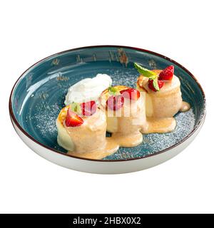 Isolated cottage cheese pancakes syrniki dessert Stock Photo