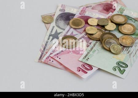Turkish money twenty,ten and five lira banknotes on the white surface with coins and copy space Stock Photo