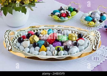 Luxury,Colorful,Traditional Turkish Hard Almond Candies and Chocolates in the metal tray on feast table. Stock Photo