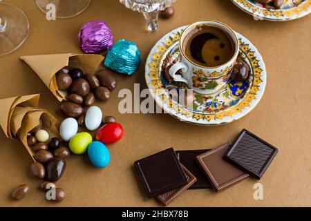 Traditional Turkish Coffee on brown surface with madlen and ball chocolates.Conceptual image for celebrations. Stock Photo