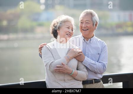 Happy elderly couple resting in the park Stock Photo