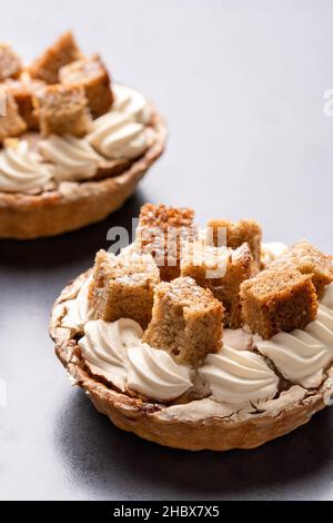 Banoffee High. A butter pastry tart layered with fresh banana slices & homemade caramel sauce, then covered with light dairy cream Stock Photo