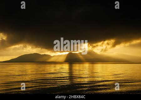 Dramatic sunrise over Hinchinbrook Island in Queensland. Stock Photo