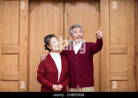 Happy old couple looking far away Stock Photo