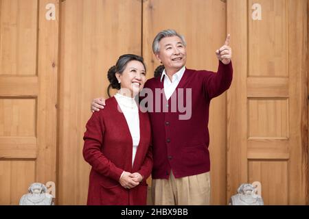 Happy old couple looking far away Stock Photo