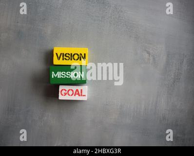 Wooden cubes with text VISION, MISSION and GOAL. Copy space for text Stock Photo