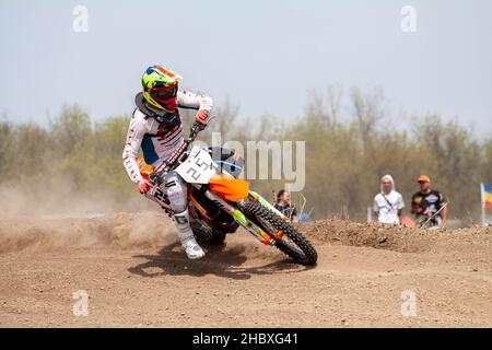 RUSSIA, Novoshakhtinsk - MAY 08, 2021: Motorcyclists ride sports cross-country motorcycles off-road Stock Photo